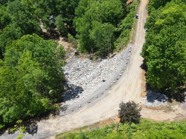 Rock along a road slope, seen from the air