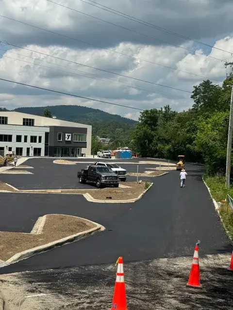 A new commercial lot with curbed islands beside a building