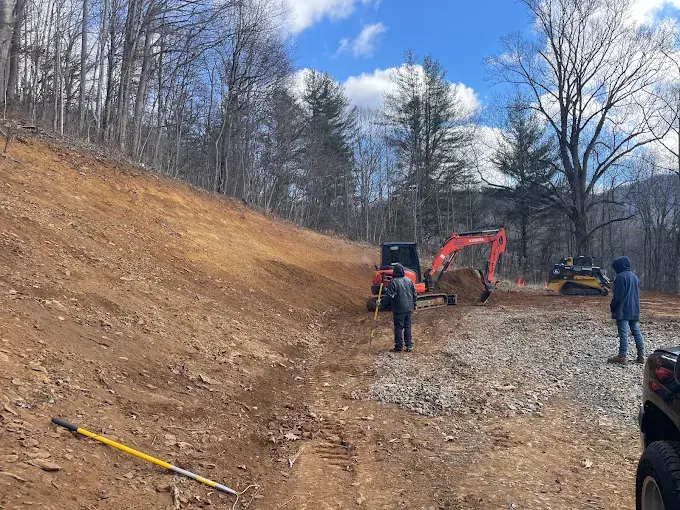 Excavators grading a hillside