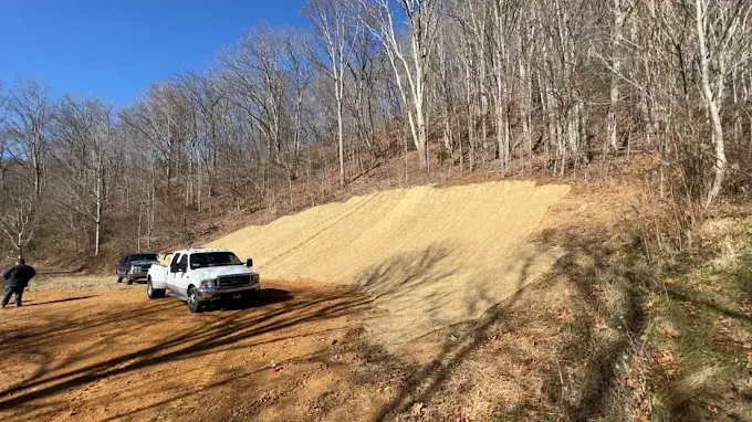 A graded slope and work area