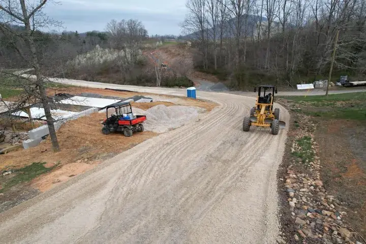 A loader grading a drive before paving