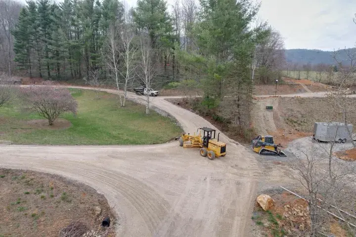 Loaders grading where two drives meet
