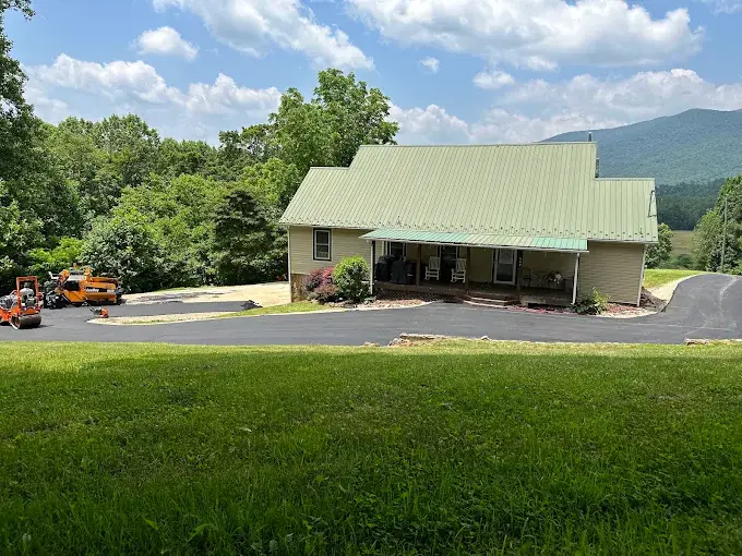 A newly paved driveway in front of a house