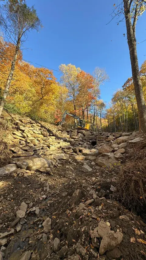 Broken rock placed on a slope in the woods