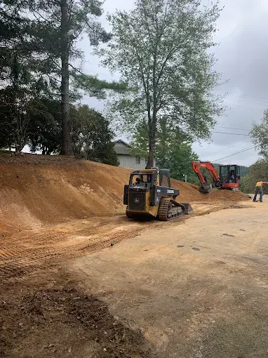 A track loader grading a site